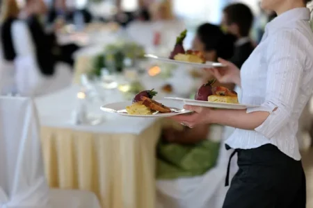 depositphotos_3119981-stock-photo-waitress-carrying-three-plates
